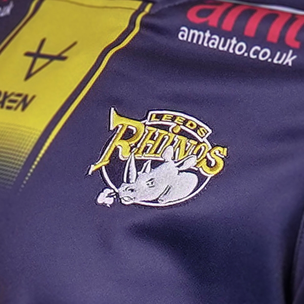 Leeds Rhinos Mens Home Rugby Shirt 2026 Blue - Badge Close-up