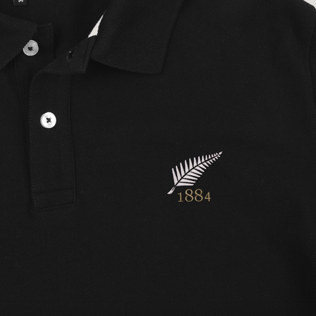 New Zealand 1884 Adults Classic Cotton Polo Shirt Black - Badge Close-up
